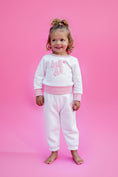 Load image into Gallery viewer, Child wearing a pink and white sweater and sweatpant outfit with text on a pink background - Thread Vision Spotlight, Rydel