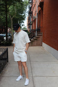 Load image into Gallery viewer, Person wearing a beige outfit with white sneakers on a sidewalk. - Thread Vision Spotlight, Kinda Handsome