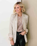 Load image into Gallery viewer, Woman wearing a sequin jacket against a neutral wall - Thread Vision Spotlight, Loverly Grey