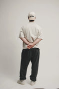 Load image into Gallery viewer, Back view of model wearing Kinda Handsome two-tone NY at Rest baseball cap in new colorway, sold out twice, photographed in minimalist studio