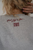 Load image into Gallery viewer, Gray sweatshirt with text and logo on the back - Thread Vision Spotlight, Move Like Morgan