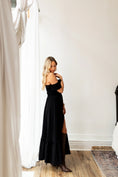 Load image into Gallery viewer, Woman in a black dress standing in a room with white walls and wooden flooring. - Thread Vision Spotlight, Hill x Sarah, Sarah Hill