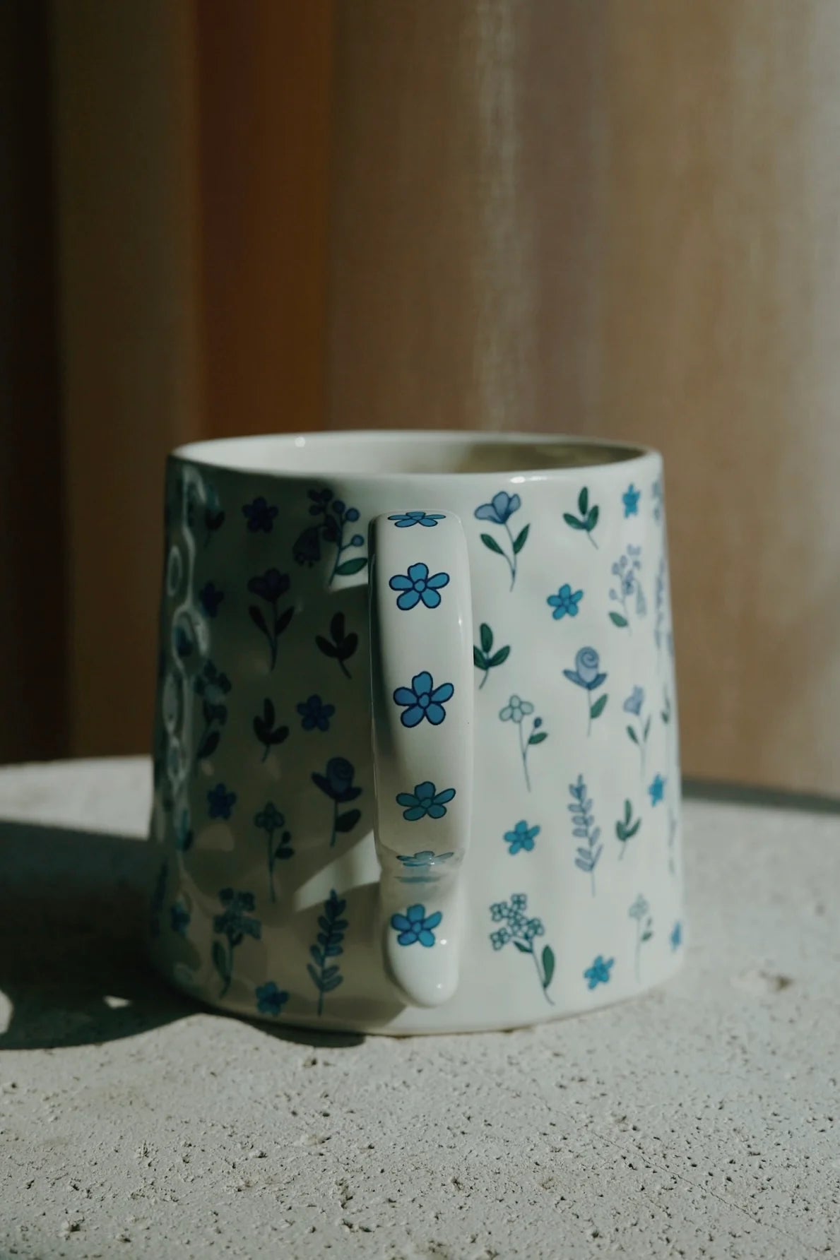 Ceramic mug with floral pattern on a speckled surface - Thread Vision Spotlight, Ignited Apparel