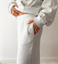 Load image into Gallery viewer, Person wearing a gray tracksuit with a blurred background - Thread Vision Spotlight, Hill x Sarah, Sarah Hill 
