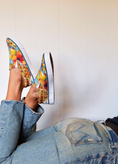 Load image into Gallery viewer, Person wearing colorful sneakers with fruit design and blue jeans against a white wall. - Thread Vision Client Spotlight, Goldfish Kiss
