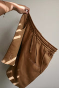 Load image into Gallery viewer, Brown shorts with a brand logo on a plain background - Thread Vision Spotlight, Ignited Apparel
