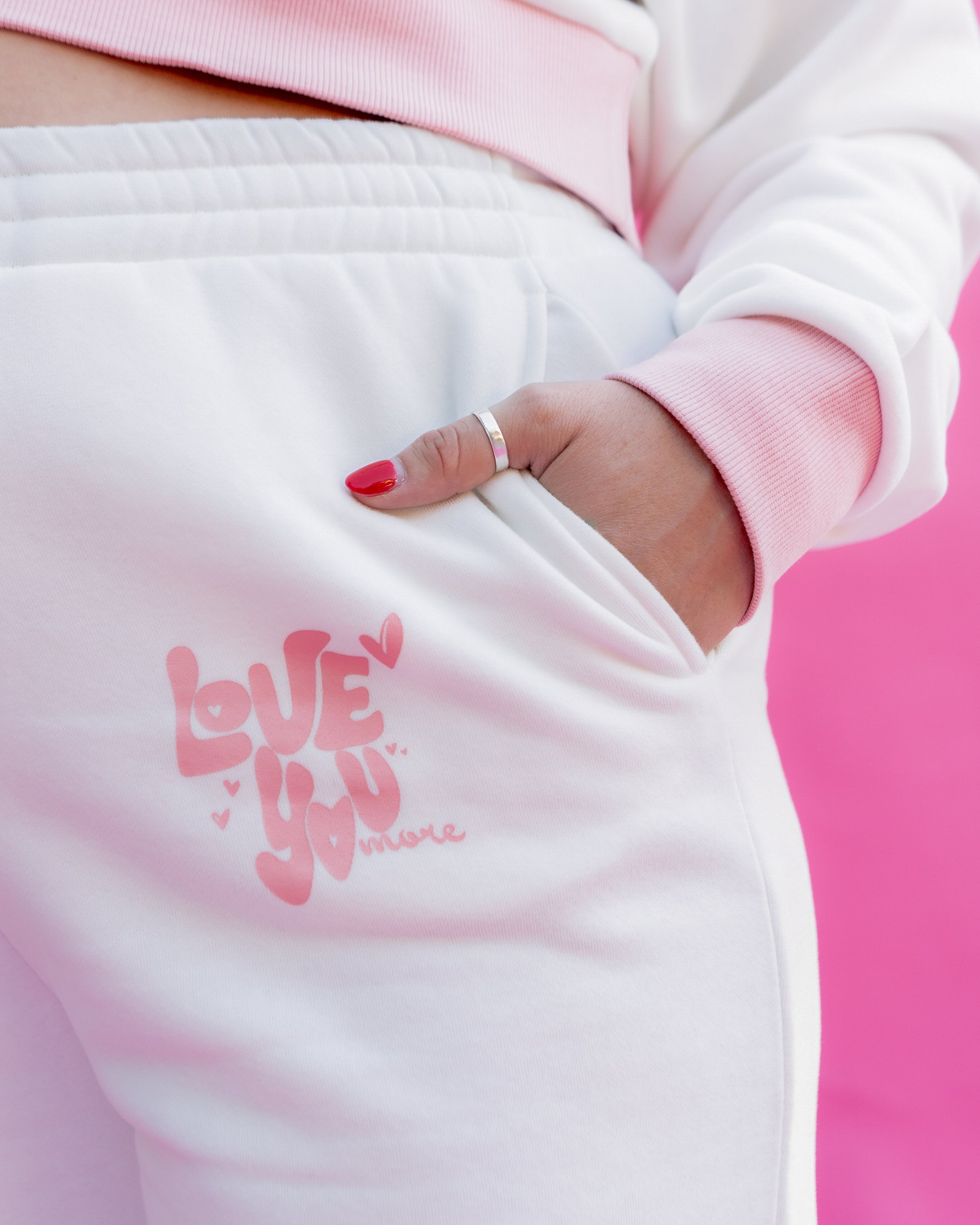 White sweatpants with pink text 'LOVE YOU' on a pink background - Thread Vision Spotlight, Rydel