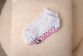 Load image into Gallery viewer, White ankle sock with pink heart pattern on a beige surface - Thread Vision Client Spotlight, 10/10 Deanna Giulietti 
