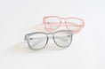 Load image into Gallery viewer, Two pairs of glasses, one gray and one pink, on a light background - Thread Vision Spotlight, Remington Avenue
