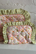 Load image into Gallery viewer, Floral-patterned cushions with green checkered trim on a white surface. Thread Vision Client Spotlight, Maude & May by Talia Hubble
