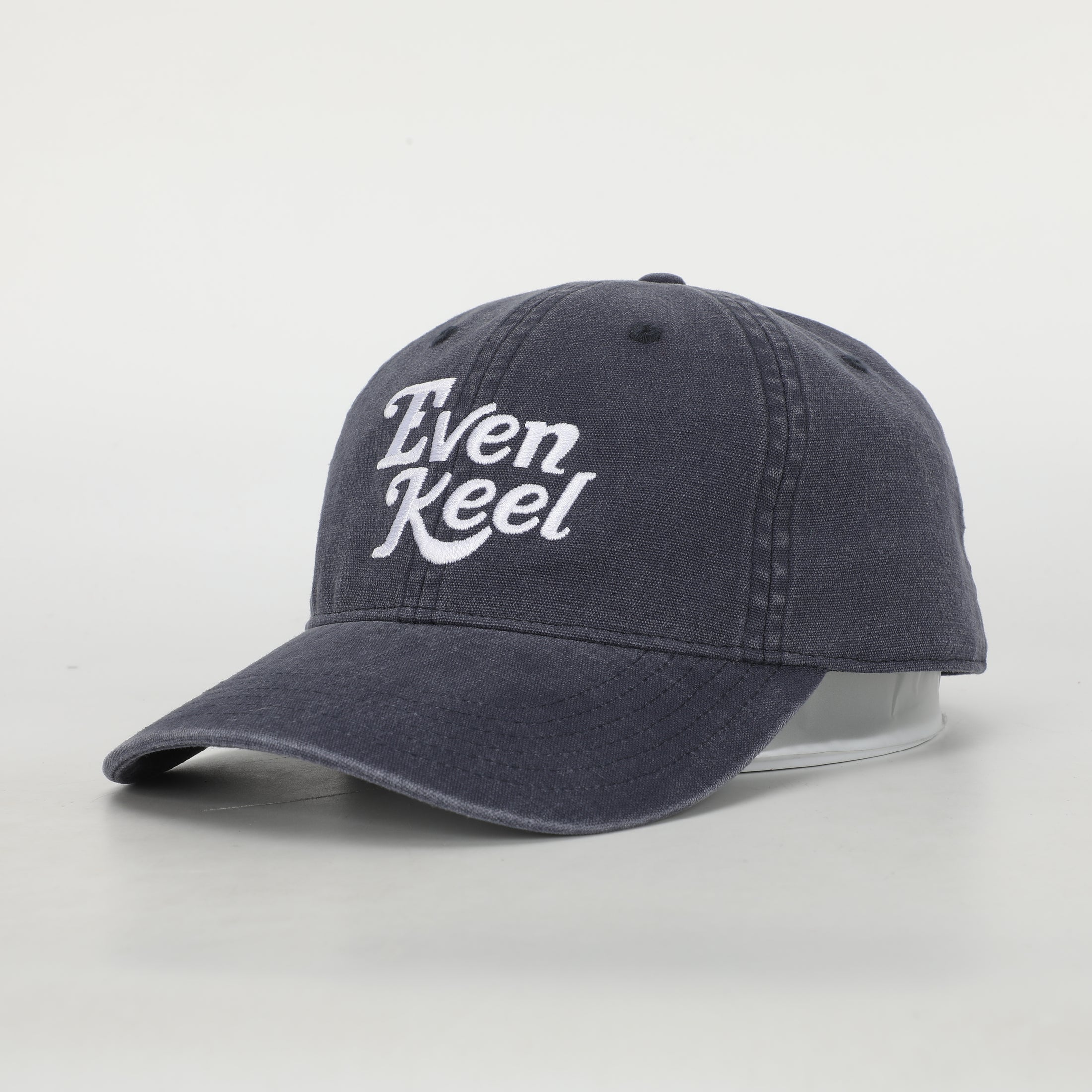 Navy blue cap with 'Even Keel' text on a light gray background - Thread Vision Client Spotlight
