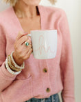 Load image into Gallery viewer, Person wearing a pink cardigan holding a white mug with 'hi' written on it. - Thread Vision Spotlight, Loverly Grey
