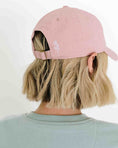 Load image into Gallery viewer, Person wearing a pink cap with a white logo on a plain background - Thread Vision Spotlight, Loverly Grey
