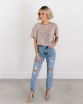 Load image into Gallery viewer, Woman wearing a beige t-shirt and ripped blue jeans against a white background - Thread Vision Spotlight, Loverly Grey
