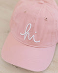 Load image into Gallery viewer, Pink cap with 'hi' embroidered on a light wooden surface - Thread Vision Spotlight, Loverly Grey
