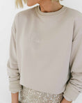Load image into Gallery viewer, Beige sweatshirt with 'shine on' text worn by a person, white background - Thread Vision Spotlight, Loverly Grey
