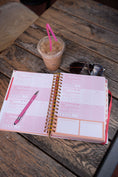 Load image into Gallery viewer, Open planner with pink pen, iced coffee, and sunglasses on a wooden table - Thread Vision Spotlight, Move Like Morgan

