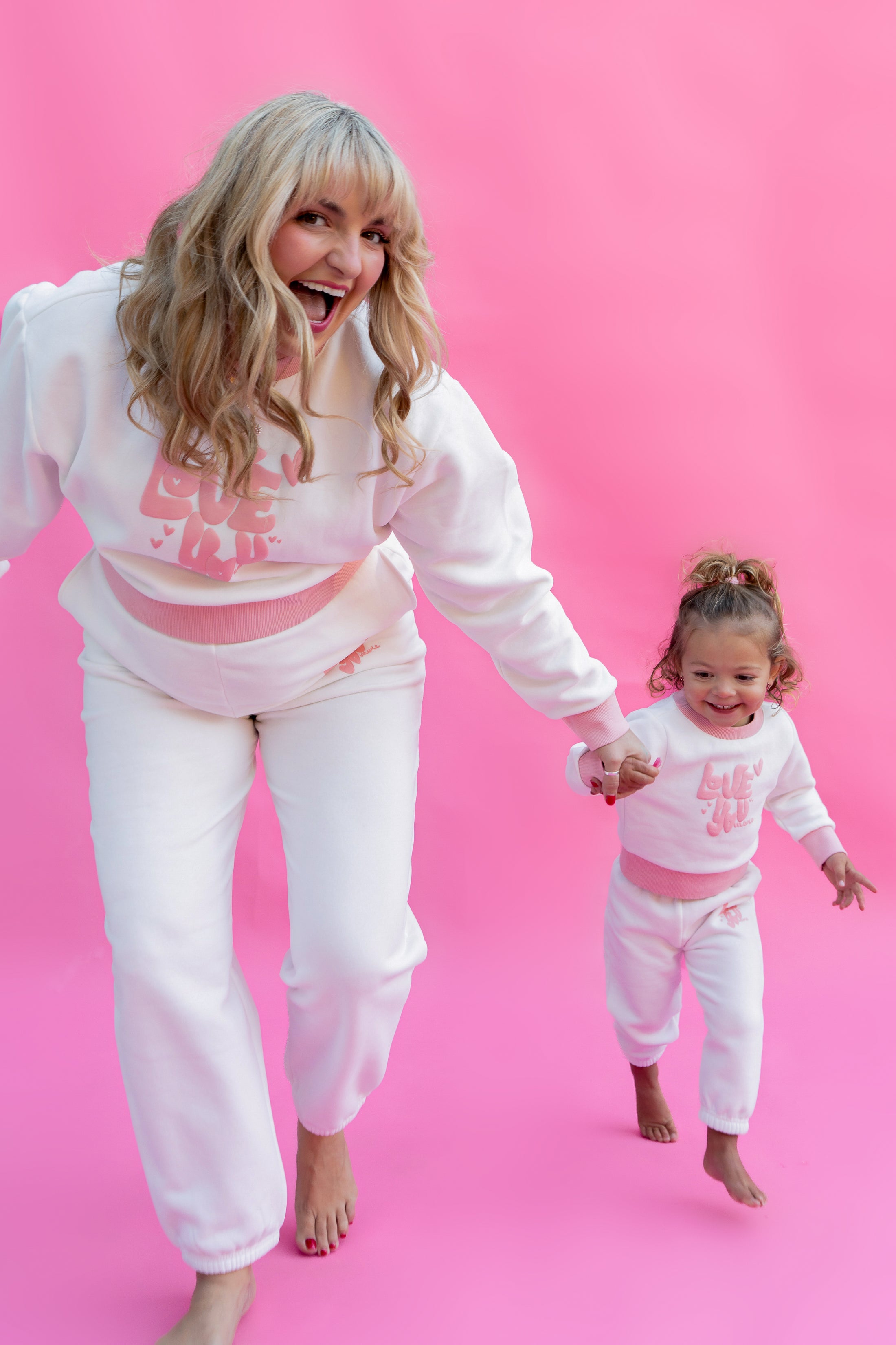 Woman and child in matching pink sweater outfits against a pink background - Thread Vision Spotlight, Rydel