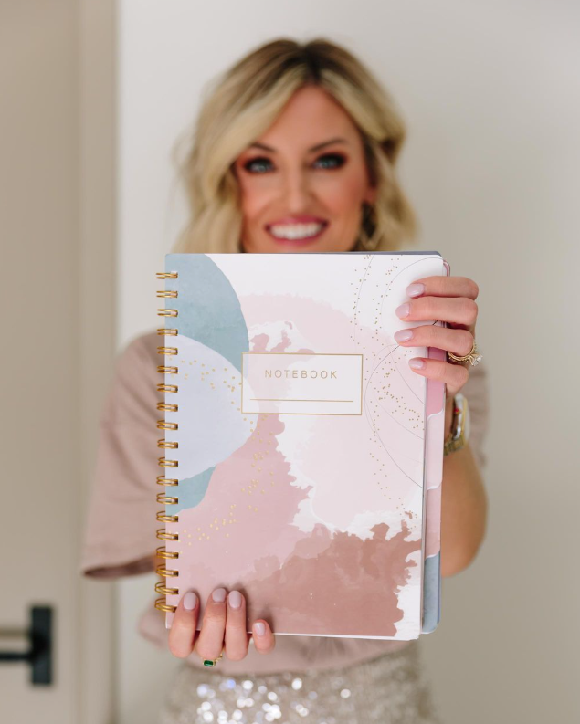Woman holding a spiral-bound notebook with a decorative cover - Thread Vision, Client Life With Loverly
