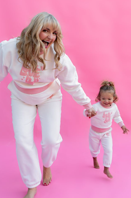 Woman and child in matching pink and white outfits on a pink background   Thread Vision, Client Rydel