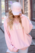 Load image into Gallery viewer, Person wearing a pink sweatshirt and cap outdoors -  - Thread Vision, Client Logo, Move Like Morgan
