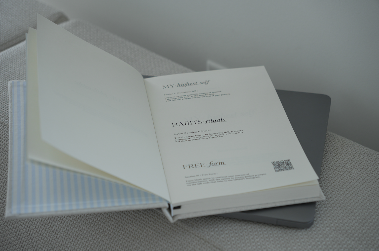 Open book with text and a QR code on a textured surface Thread Vision Spotlight, HMBDY