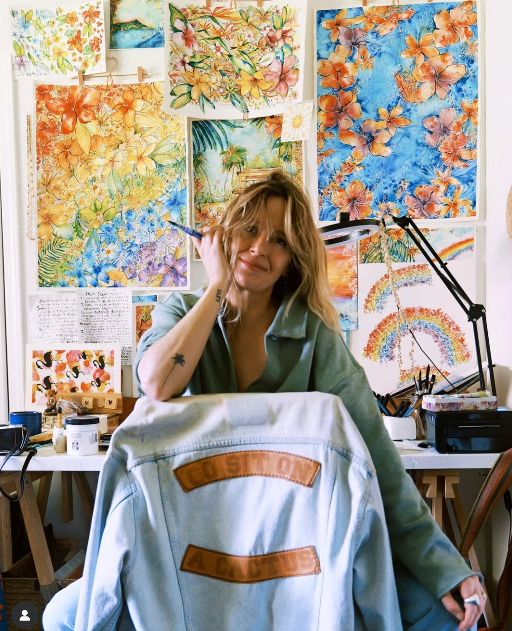 Person in a studio with colorful artwork on the wall - Thread Vision Client Spotlight, Goldfish Kiss