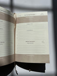 Load image into Gallery viewer, Open notebook with lined pages on a reflective surface, Thread-Vision-Karina-Faith-Diaries
