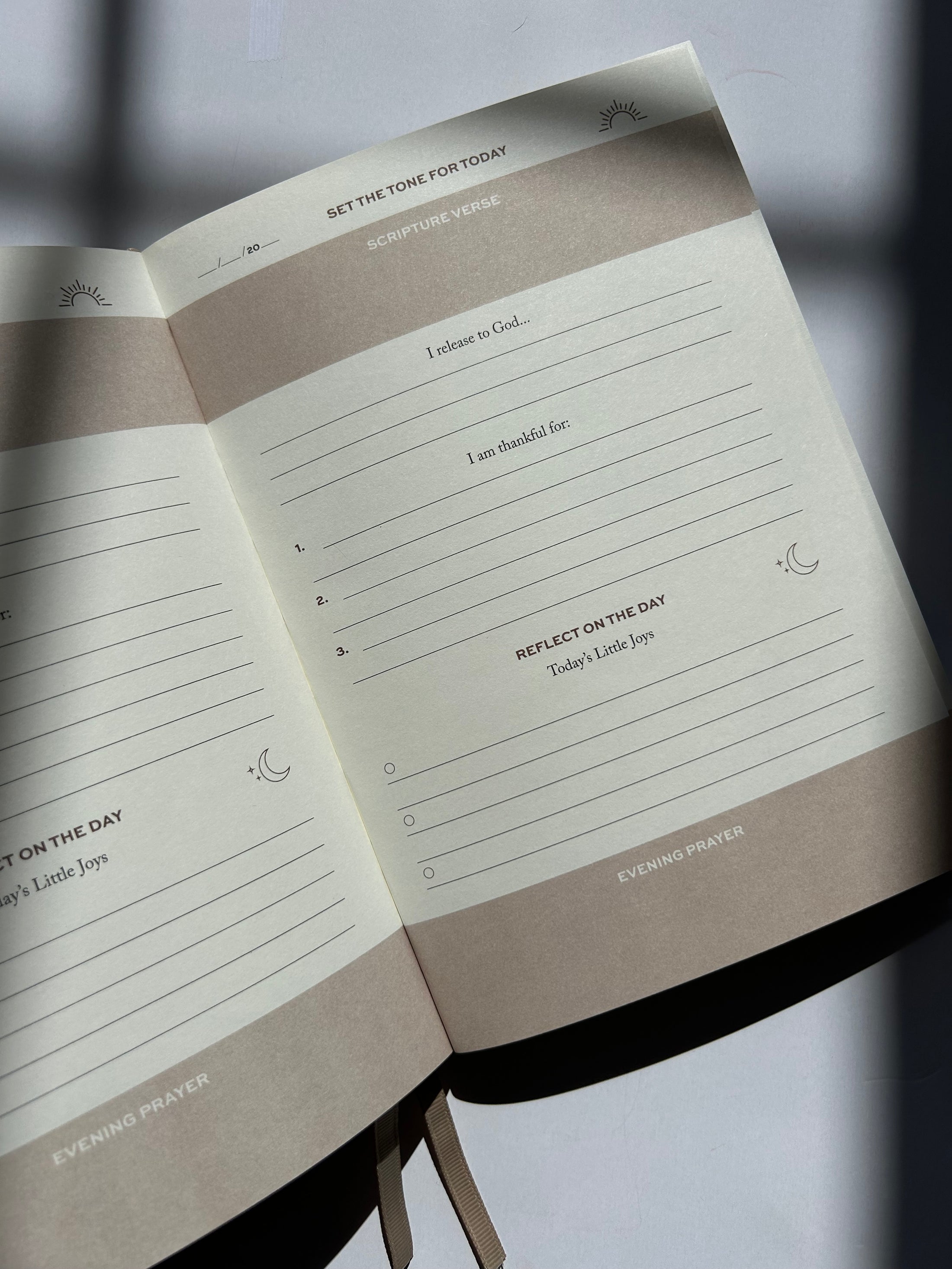 Open notebook with lined pages on a blurred background Thread-Vision-Karina-Faith-Diaries