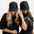 Load image into Gallery viewer, Two women wearing black caps with 'DAY1 Fitness' logo on a plain background - Thread Vision Spotlight, Day 1 Fitness, Kaylee Rogers
