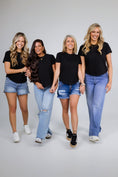 Load image into Gallery viewer, Four women standing side by side wearing black t-shirts and blue jeans on a white background - Thread Vision Spotlight, Day 1 Fitness, Kaylee Rogers 

