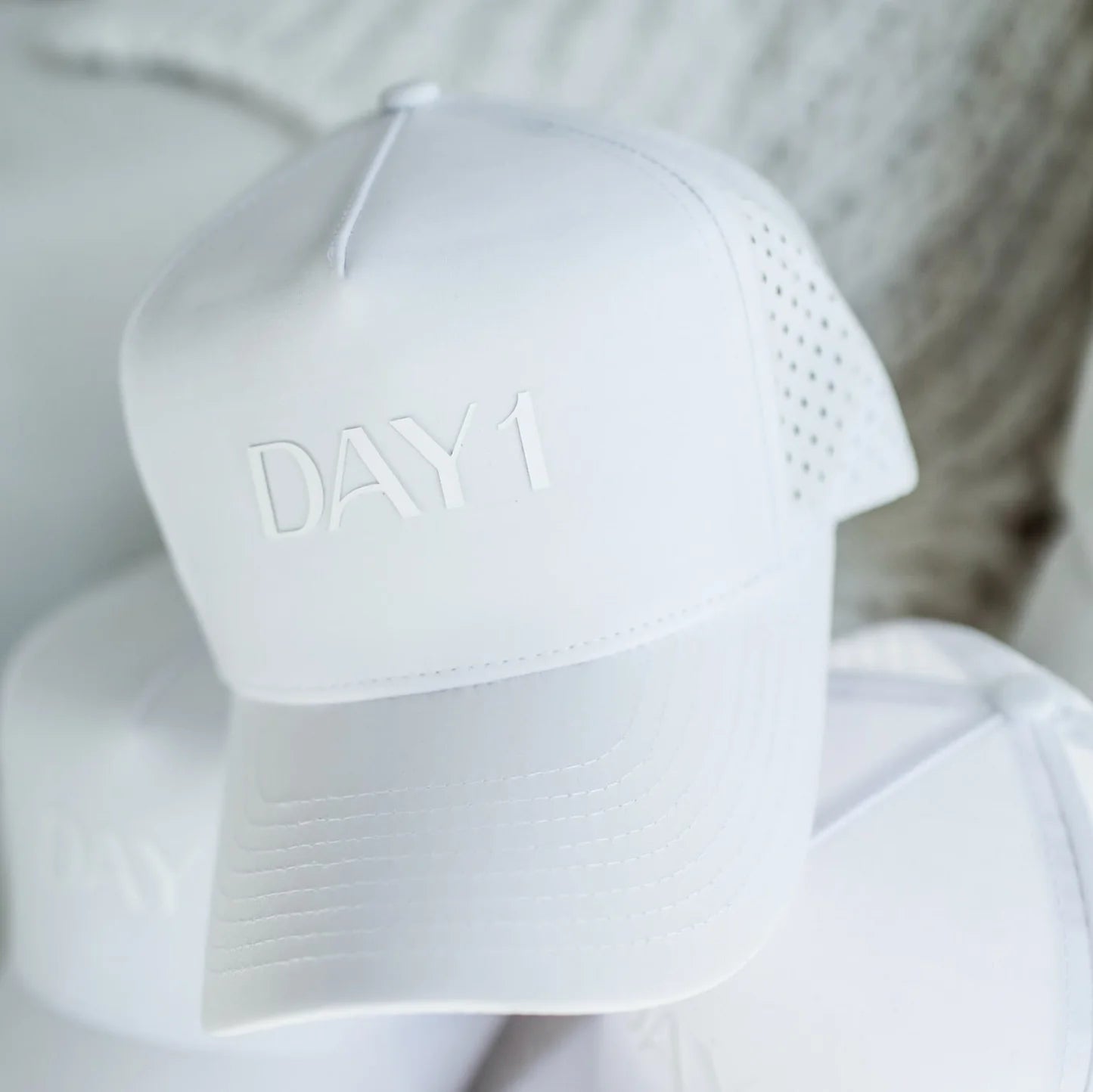 White cap with 'DAY 1' text on a blurred background - Thread Vision Spotlight, Day 1 Fitness, Kaylee Rogers 